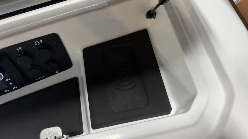 Slide: The Image of The image shows the dashboard of a Nautique Super Air Nautique GS20 with controls and a storage area. - 48