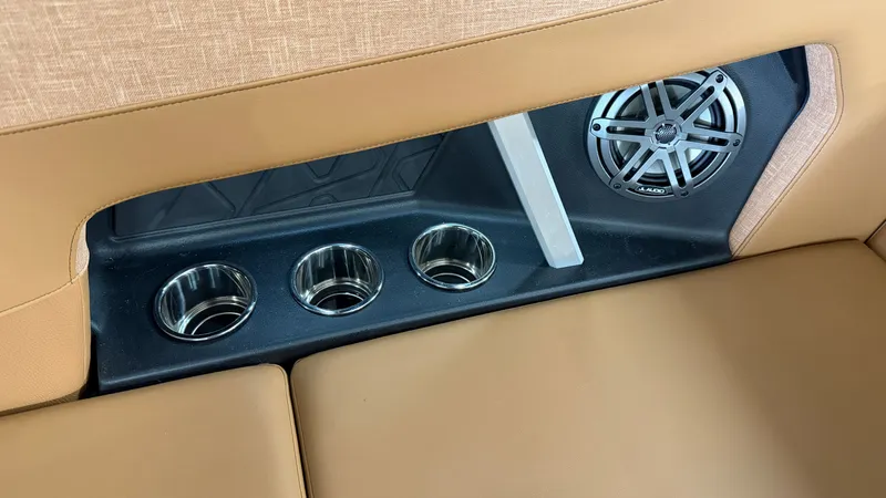 Slide: The Image of Close-up of a boat seat with three cup holders and a speaker. - 33