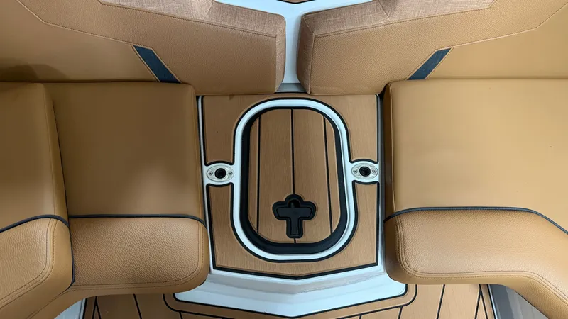 Slide: The Image of The image shows a boat interior with brown upholstery and a sleek wooden floor. - 35