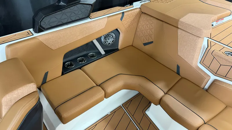 Slide: The Image of The image shows the luxurious interior of a Nautique Super Air Nautique GS20 with beige upholstery. - 23