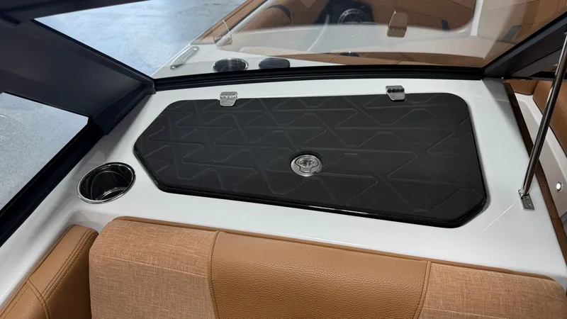 Slide: The Image of The image shows the interior of a 2026 Nautique Super Air Nautique GS20 with brown seating. - 46