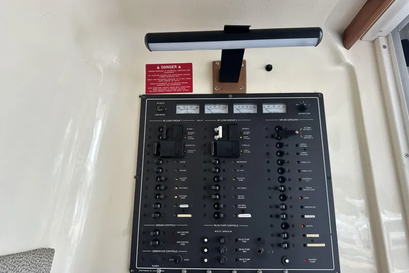 Slide: The Image of Electrical control panel on a 1998 Mainship 40 Sedan Bridge boat. - 18
