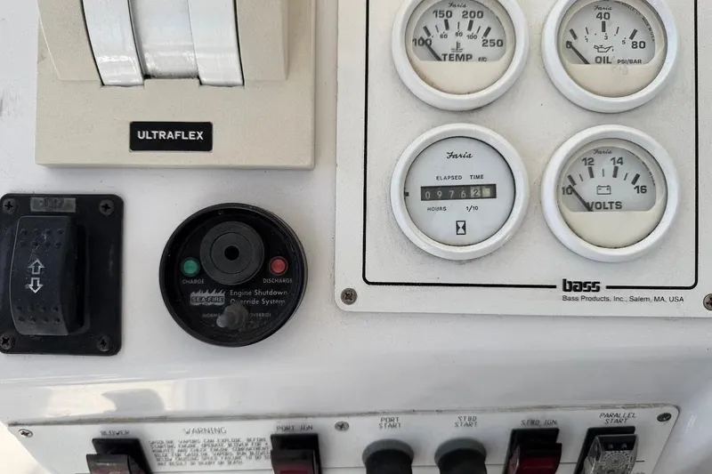 Slide: The Image of Control panel of a 1998 Mainship 40 Sedan Bridge with gauges and switches. - 26