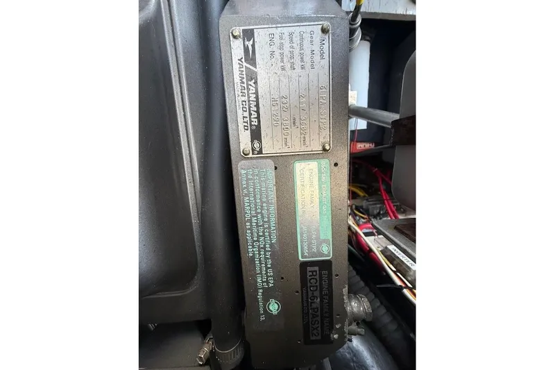 Slide: The Image of Engine compartment of 1998 Mainship 40 Sedan Bridge with Yanmar engine details. - 29