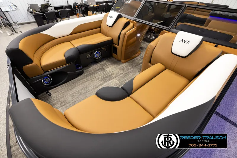 Slide: The Image of Luxurious interior of 2026 Avalon LSZ ELW pontoon boat with tan and black seating. - 10