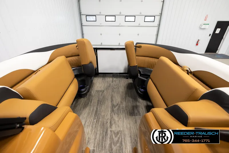 Slide: The Image of 2026 Avalon LSZ ELW boat interior with tan seating and wood-style flooring. - 19