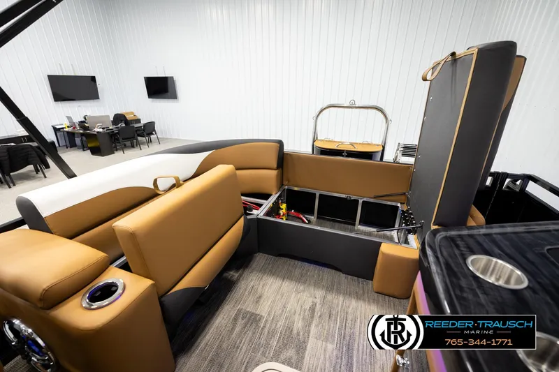 Slide: The Image of 2026 Avalon LSZ ELW boat interior with tan seating and modern amenities. - 21