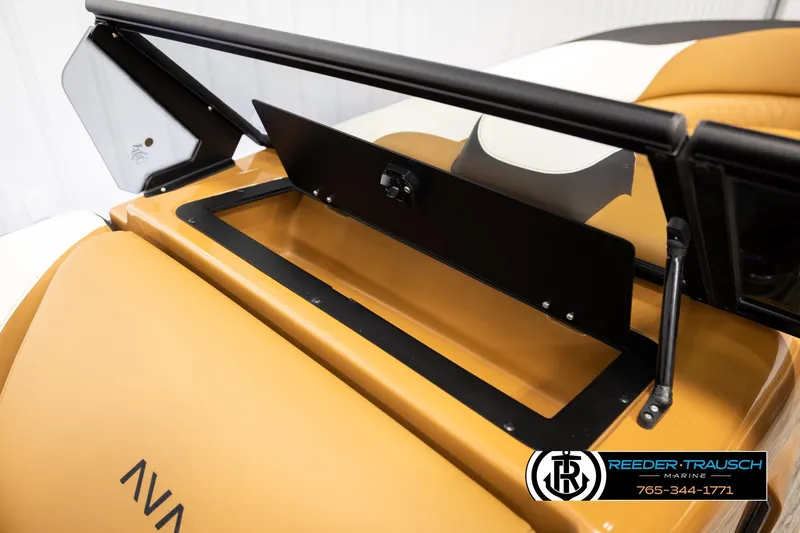 Slide: The Image of 2026 Avalon LSZ ELW boat storage compartment with sleek design and Reeder-Trausch Marine logo. - 25