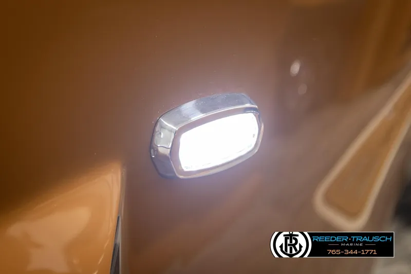 Slide: The Image of Close-up of 2026 Avalon LSZ ELW boat light, with Reeder-Trausch Marine logo. - 44