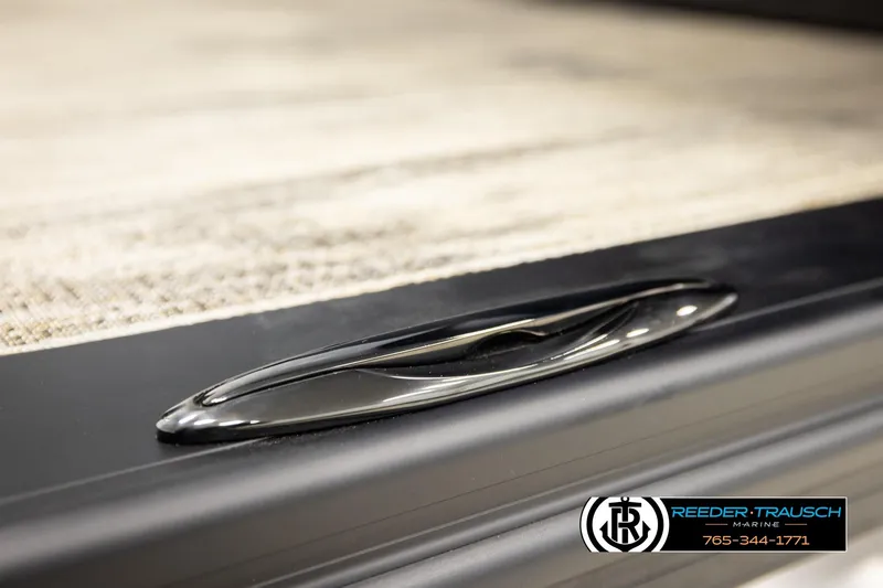 Slide: The Image of Close-up of 2026 Avalon LSZ ELW boat detail with Reeder-Trausch Marine logo. - 51