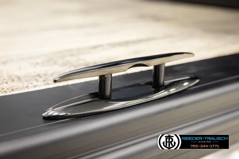Slide: The Image of Close-up of a 2026 Avalon LSZ ELW boat cleat, featuring sleek design and Reeder-Trausch Marine logo. - 52