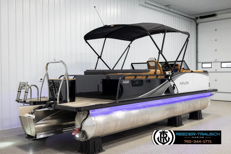 Slide: The Image of 2026 Avalon LSZ ELW pontoon boat in showroom with canopy and LED lights. - 6