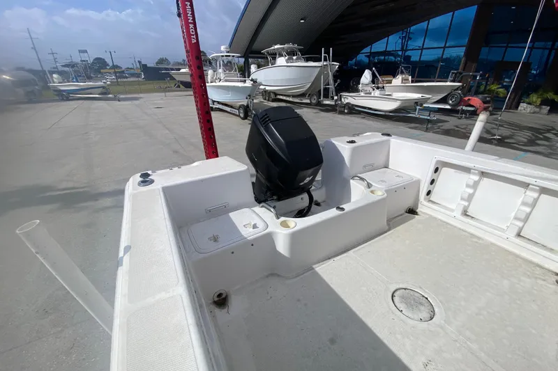 Slide: The Image of 2005 PROLINE 21 boat with outboard motor in a marina setting. - 14