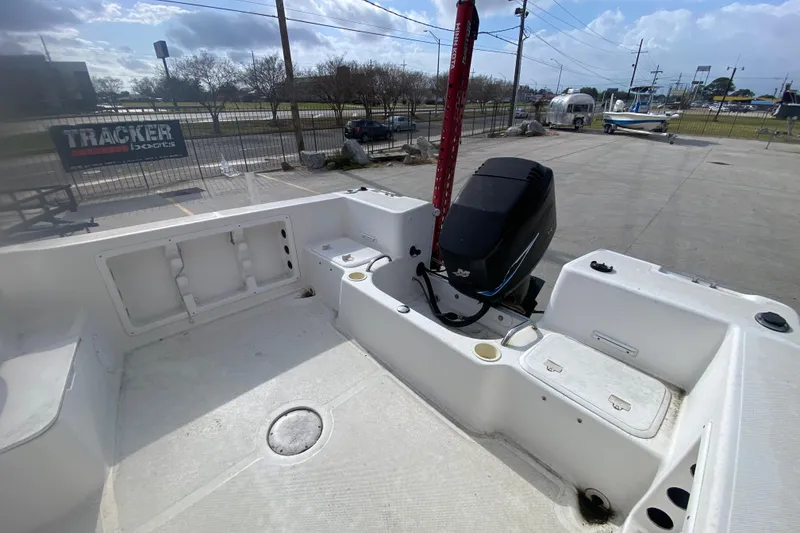 Slide: The Image of 2005 PROLINE 21 boat interior with motor, docked at a marina. - 15