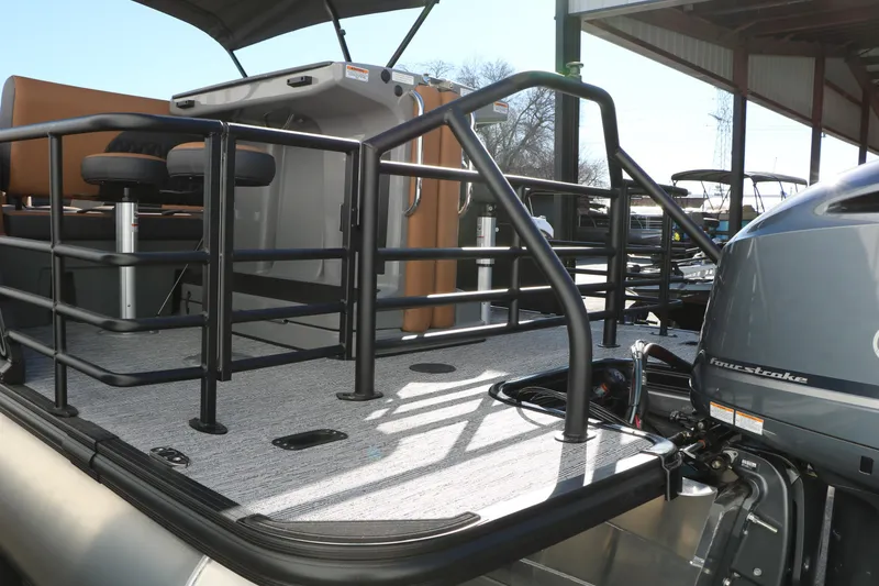 Slide: The Image of 2026 Sylvan L3 DLZ Bar Tri-Toon boat with bar seating and four-stroke engine. - 13