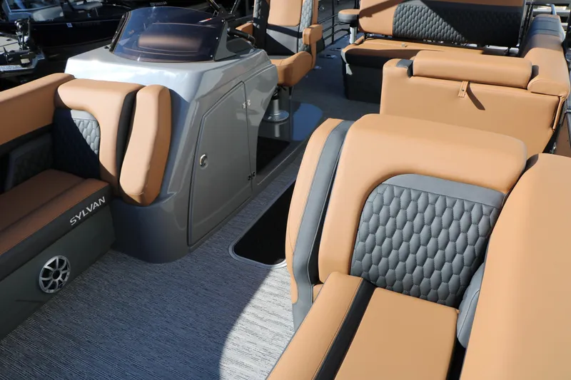 Slide: The Image of Luxurious interior of 2026 Sylvan L3 DLZ Bar Tri-Toon with tan and gray seating. - 19