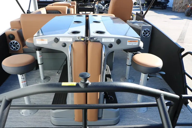 Slide: The Image of 2026 Sylvan L3 DLZ Bar Tri-Toon interior with bar stools and table setup. - 22