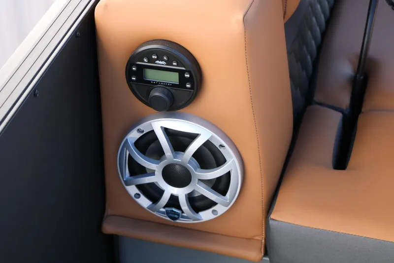 Slide: The Image of 2026 Sylvan L3 DLZ Bar Tri-Toon interior with speaker and control panel. - 24