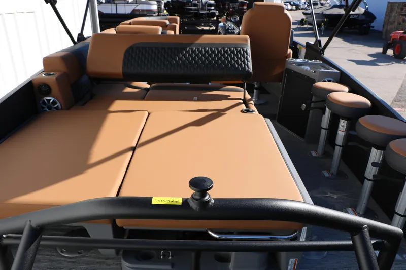 Slide: The Image of 2026 Sylvan L3 DLZ Bar Tri-Toon interior with tan seating and bar stools. - 29