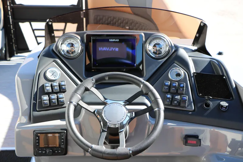 Slide: The Image of Dashboard of 2026 Sylvan L3 DLZ Bar Tri-Toon with steering wheel and controls. - 37