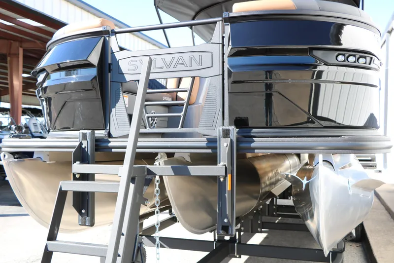 Slide: The Image of 2026 Sylvan L3 DLZ Bar Tri-Toon boat with sleek black design and sturdy ladder. - 6