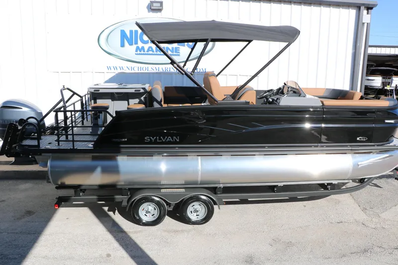 Slide: The Image of 2026 Sylvan L3 DLZ Bar Tri-Toon boat with canopy on trailer at Nichols Marine. - 8