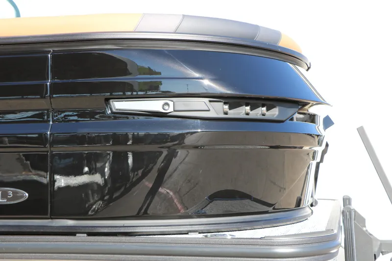 Slide: The Image of 2026 Sylvan L3 DLZ Bar Tri-Toon boat, sleek black exterior detail. - 9