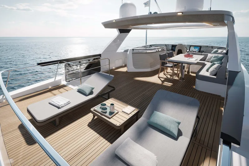 Slide: The Image of Luxurious 2026 Absolute Navetta 66 yacht deck with sun loungers and dining area. - 5