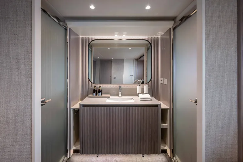 Slide: The Image of Luxurious bathroom interior on Absolute Navetta 66 yacht, 2027 model, featuring modern sink and mirror. - 60