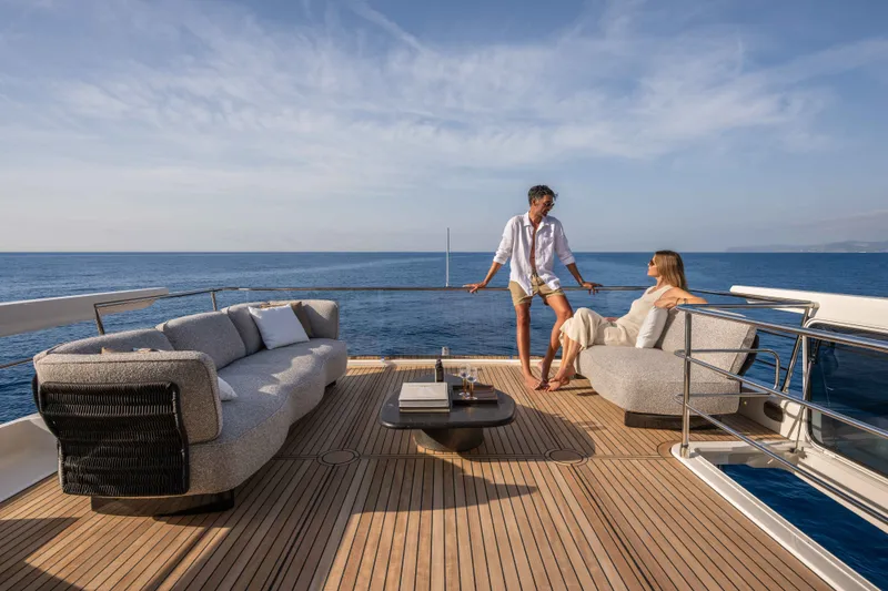 Slide: The Image of Couple relaxing on Absolute Navetta 66 yacht deck, 2027 model, with ocean view. - 38