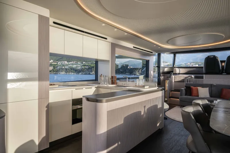 Slide: The Image of Luxurious interior of 2027 Absolute Navetta 66 yacht with modern kitchen and seating area. - 47