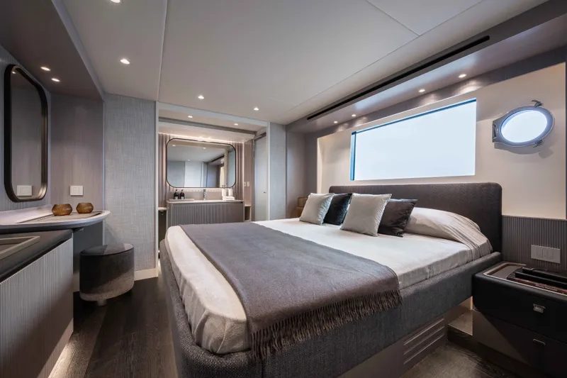 Slide: The Image of Luxurious bedroom interior of 2027 Absolute Navetta 66 yacht, featuring modern design and elegant furnishings. - 58