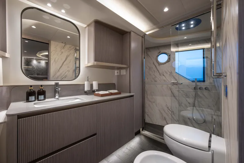 Slide: The Image of Luxurious bathroom on 2027 Absolute Navetta 66 yacht with modern fixtures and elegant design. - 56