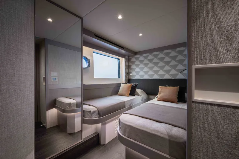 Slide: The Image of Luxurious twin bedroom interior on 2027 Absolute Navetta 66 yacht, featuring modern design and cozy ambiance. - 61