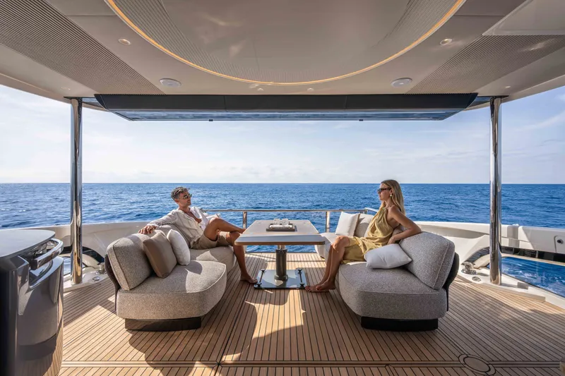 Slide: The Image of Luxury yacht Absolute Navetta 66, 2027 model, with elegant seating and ocean view. - 22