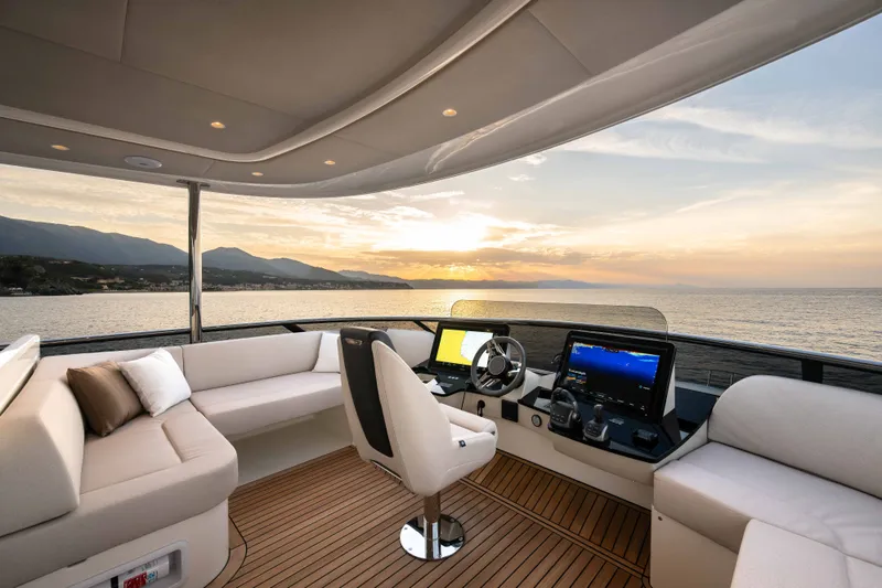 Slide: The Image of Luxurious 2027 Absolute Navetta 66 yacht interior with sunset ocean view. - 31