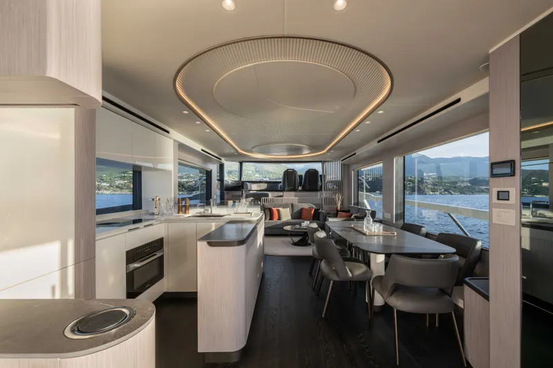 Slide: The Image of Luxurious interior of 2027 Absolute Navetta 66 yacht with modern kitchen and dining area. - 41