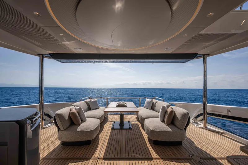Slide: The Image of Luxurious 2027 Absolute Navetta 66 yacht deck with elegant seating and ocean view. - 24