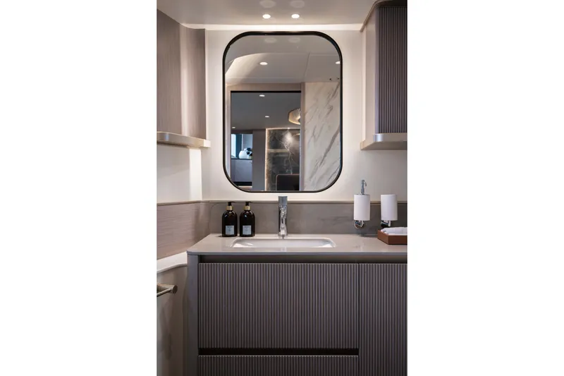 Slide: The Image of Luxurious bathroom interior of 2027 Absolute Navetta 66 yacht with modern fixtures and elegant design. - 57