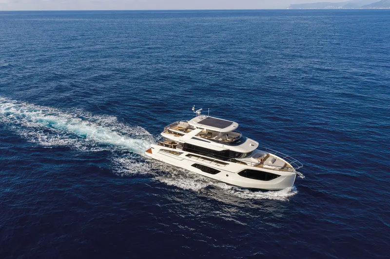 Slide: The Image of Luxurious 2027 Absolute Navetta 66 yacht cruising on open sea. - 5