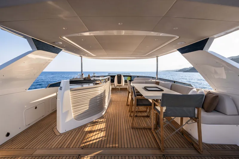 Slide: The Image of Luxurious 2027 Absolute Navetta 66 yacht deck with elegant seating and ocean view. - 40