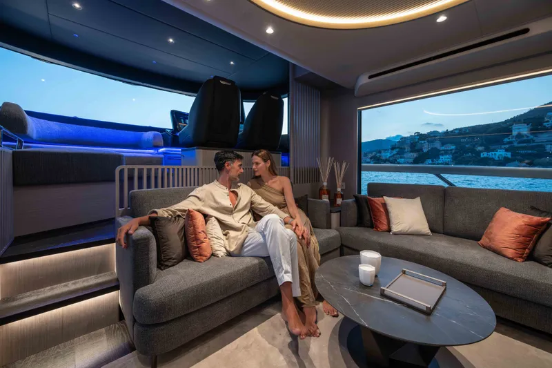 Slide: The Image of Luxurious interior of 2027 Absolute Navetta 66 yacht with couple enjoying scenic ocean view. - 44
