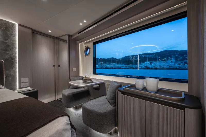 Slide: The Image of Luxurious interior of 2027 Absolute Navetta 66 yacht with panoramic window view. - 55