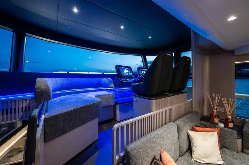 Slide: The Image of Luxurious interior of 2027 Absolute Navetta 66 yacht with modern seating and ambient lighting. - 49