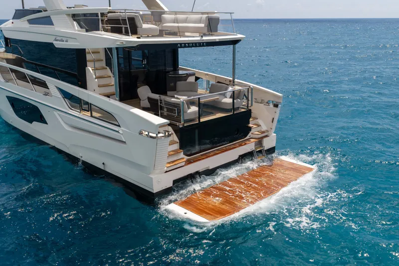 Slide: The Image of Luxury Absolute Navetta 66 yacht cruising on open sea, 2027 model. - 8