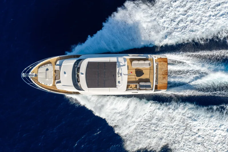 Slide: The Image of Aerial view of 2027 Absolute Navetta 66 yacht cruising on open water. - 3