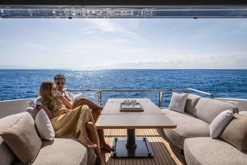 Slide: The Image of Couple relaxing on Absolute Navetta 66 yacht, 2027 model, with ocean view. - 23