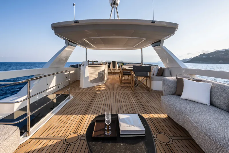 Slide: The Image of Luxurious 2027 Absolute Navetta 66 yacht deck with elegant seating and ocean view. - 36