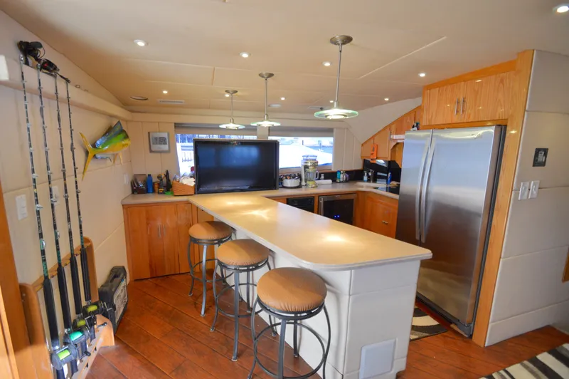 Slide: The Image of Interior of a 2004 Chesapeake 58 yacht with modern kitchen. - 11