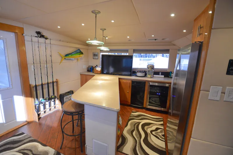 Slide: The Image of Interior of a 2004 Chesapeake 58 yacht with modern kitchen. - 12
